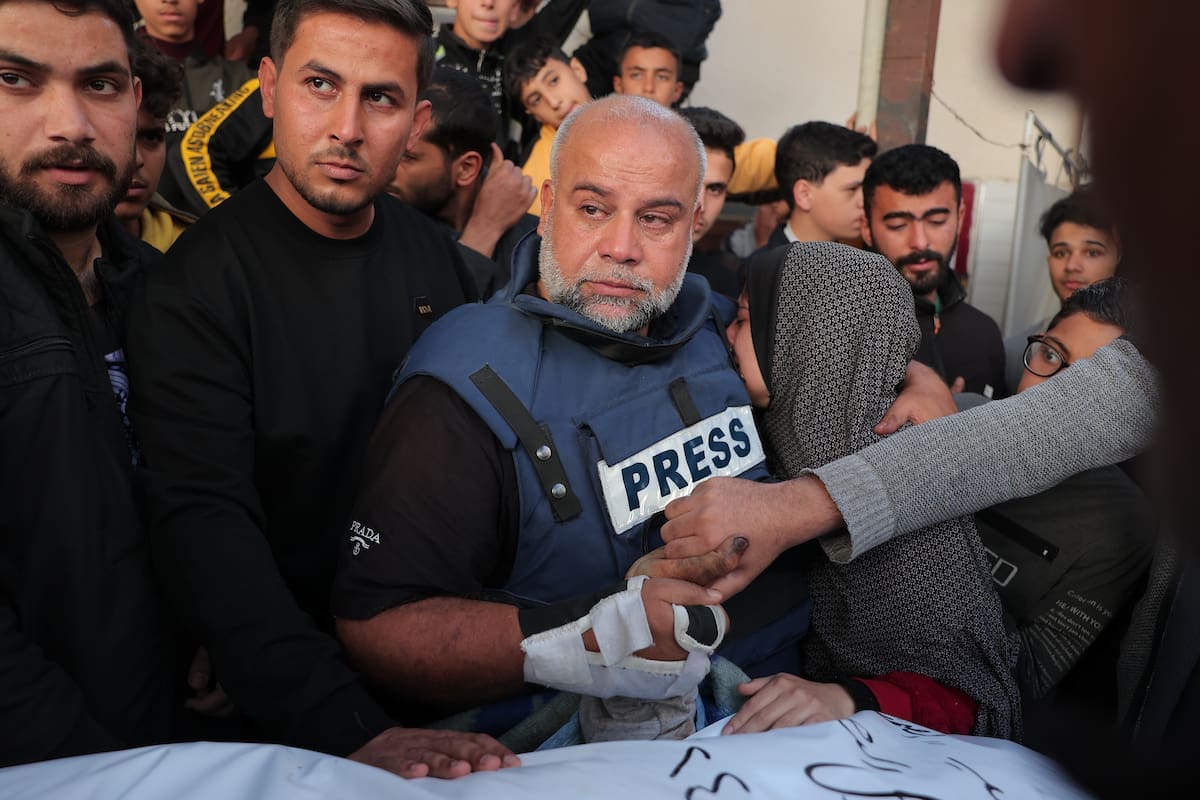 Palestinians attend in the funeral of Hamza Wael Dahdouh, a journalist with the Al Jazeera television network, who was killed in a reported Israeli air strike