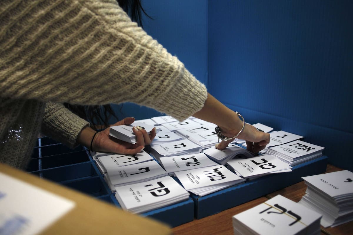 An Israeli woman casts her ballot at a polling station  in the northern city of Haifa